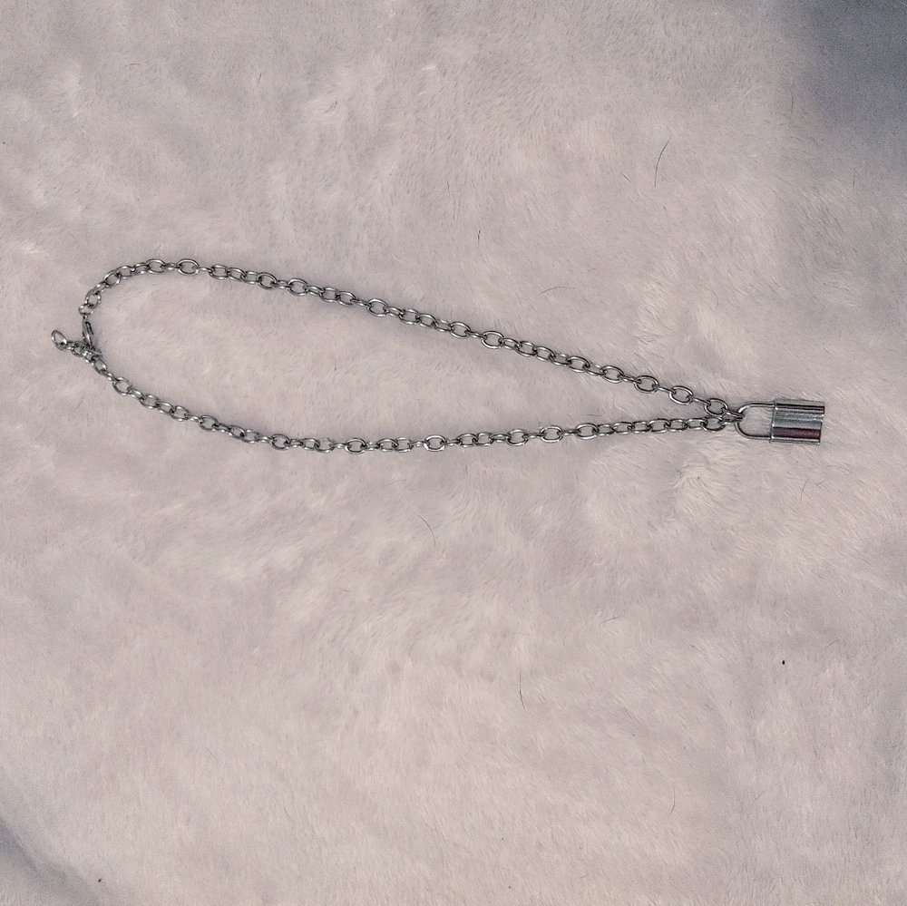 Silver lock necklace.